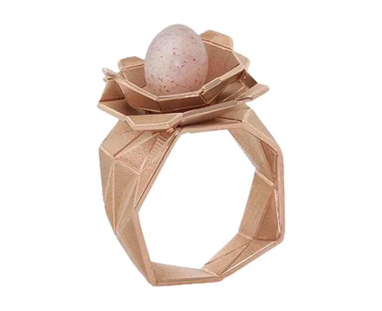 Side view of the Nido rose gold ring with moonstone and geometric structure