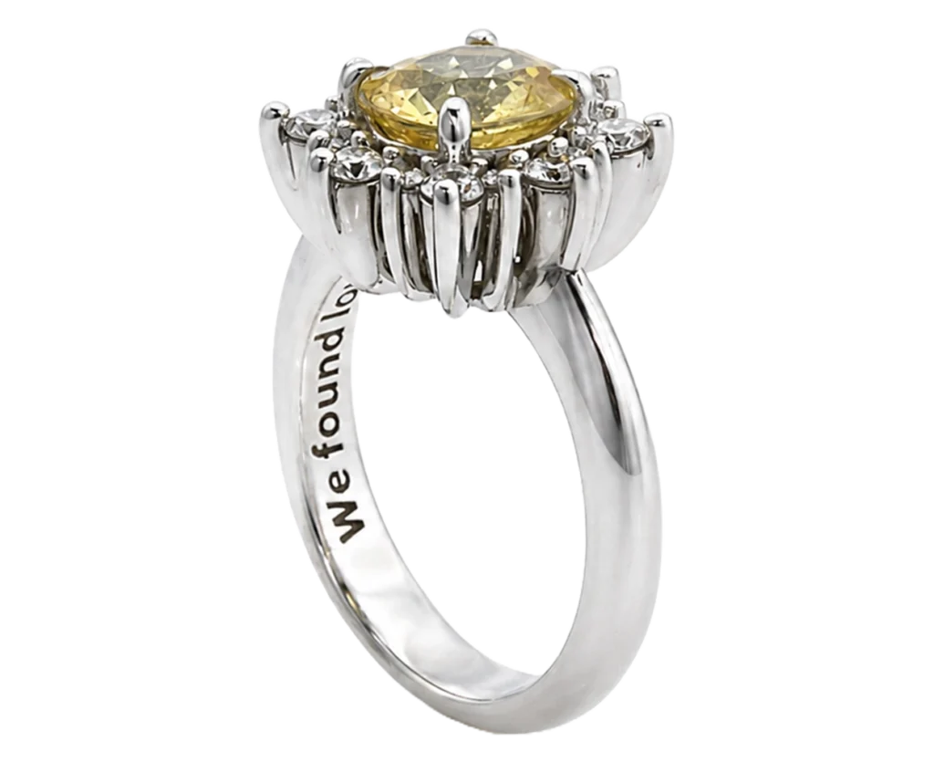 Charlotte 18-carat white gold ring with a central natural yellow sapphire and a halo of natural white diamonds