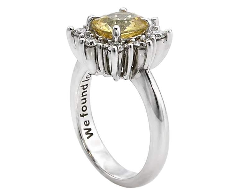 Charlotte 18-carat white gold ring with a central natural yellow sapphire and a halo of natural white diamonds