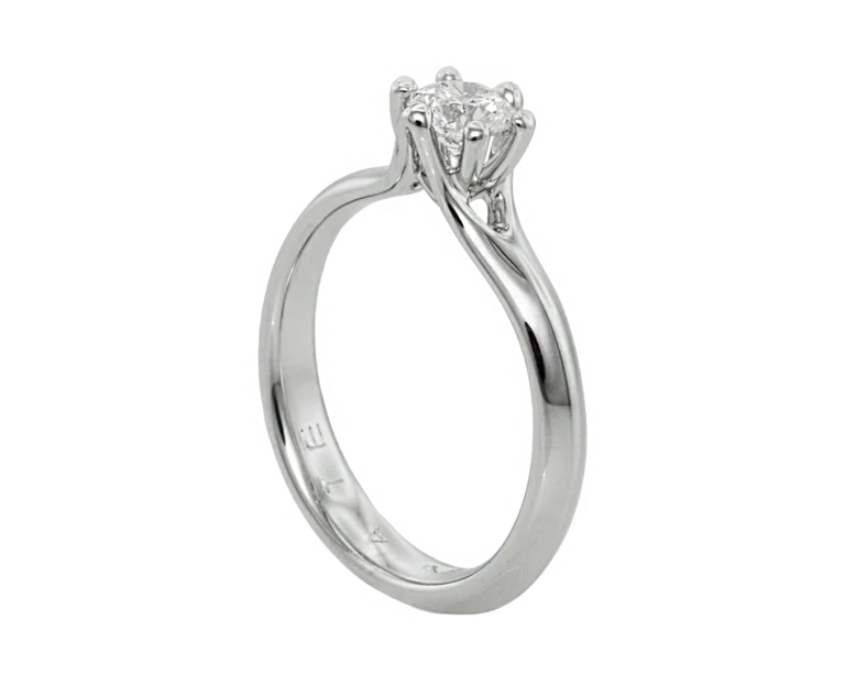 Side view of the white gold Corona ring with a natural diamond and prong setting