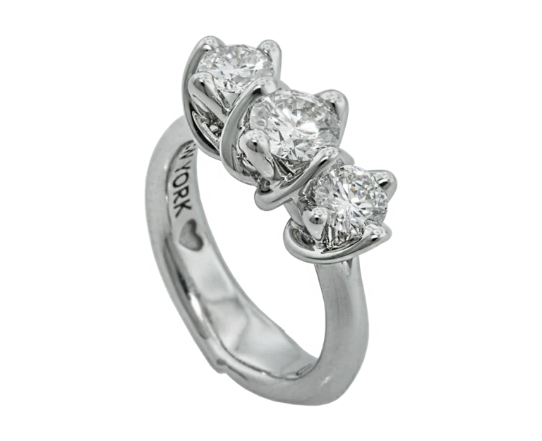 Side view of the white gold Trilogy ring with three natural diamonds