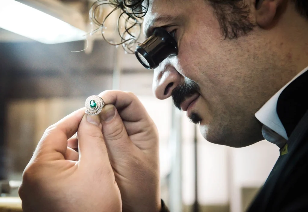 Antonio Colonna during the inspection of an emerald and diamond ring