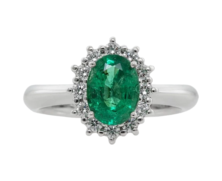 White gold ring with an oval emerald and natural diamonds viewed from the front