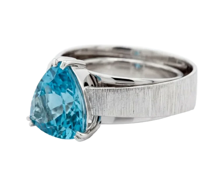 White gold ring with trillion-cut aquamarine viewed from the side