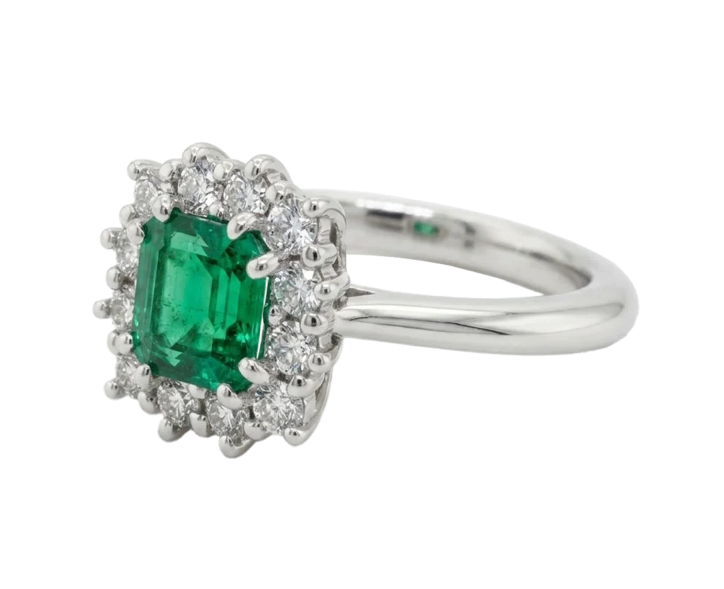 Side view of the Wisdom ring with emerald and diamonds