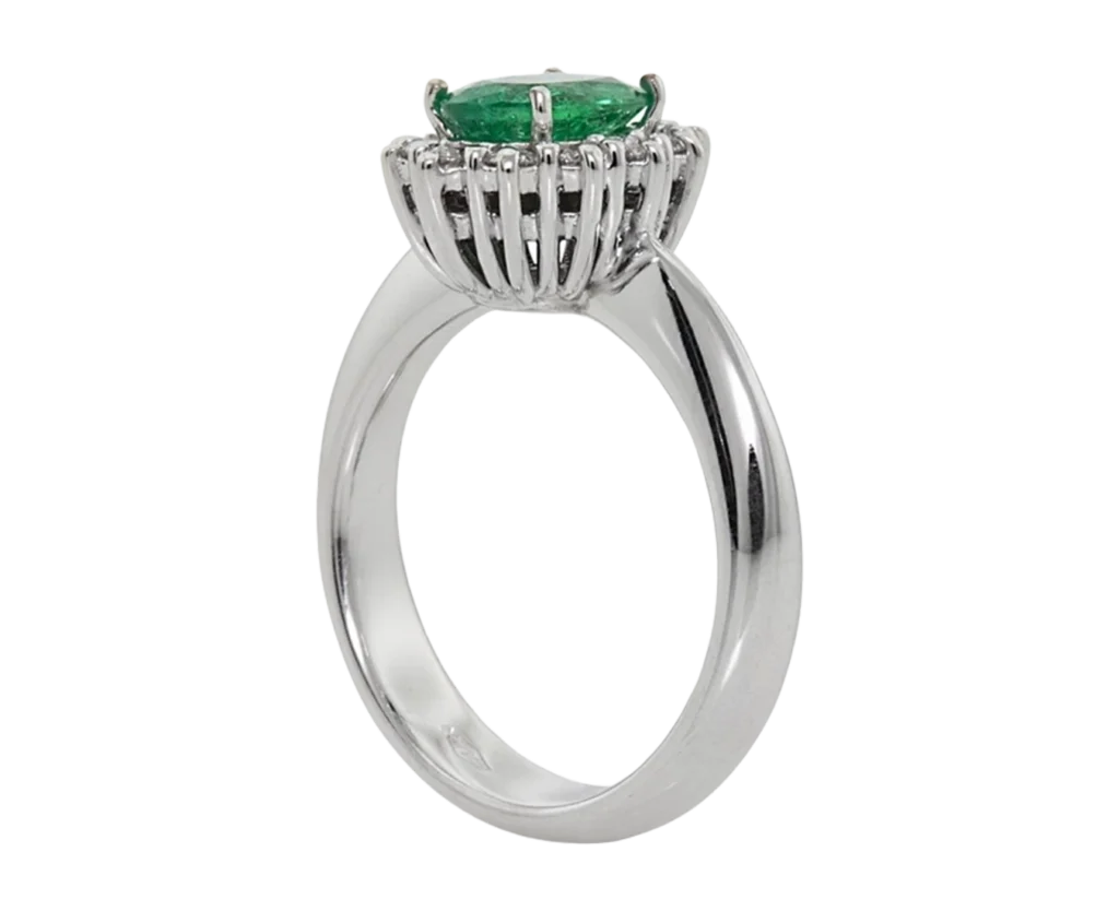 Side view of the classic Emerald ring with an open basket and claw setting