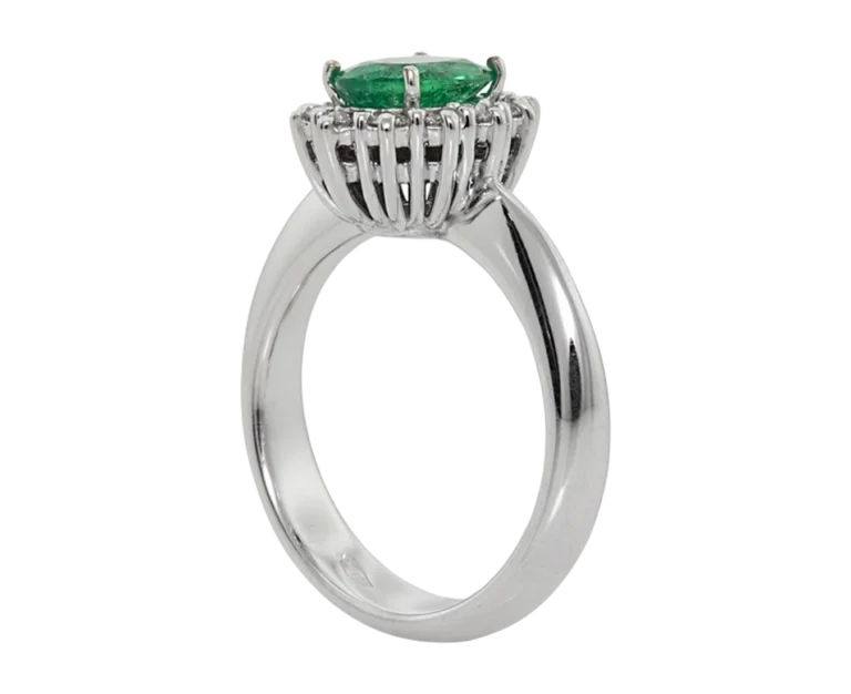 Side view of the classic Emerald ring with an open basket and claw setting