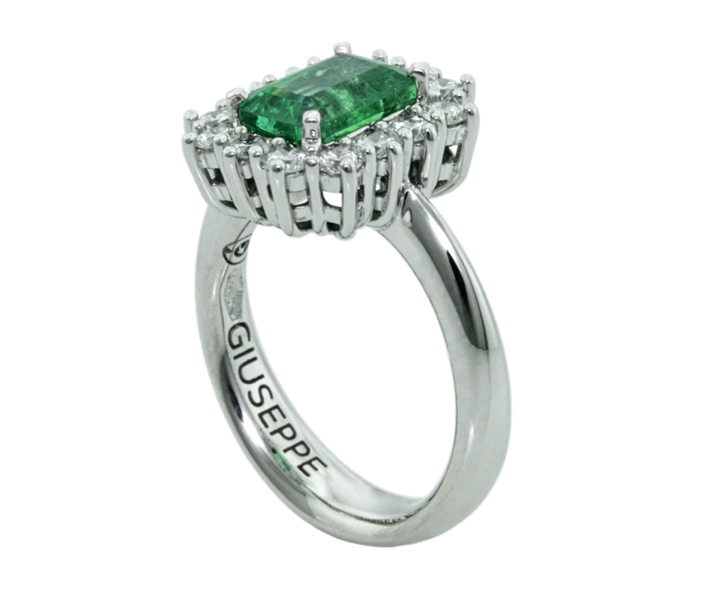Side view of the emerald-cut ring with an open basket and claw setting