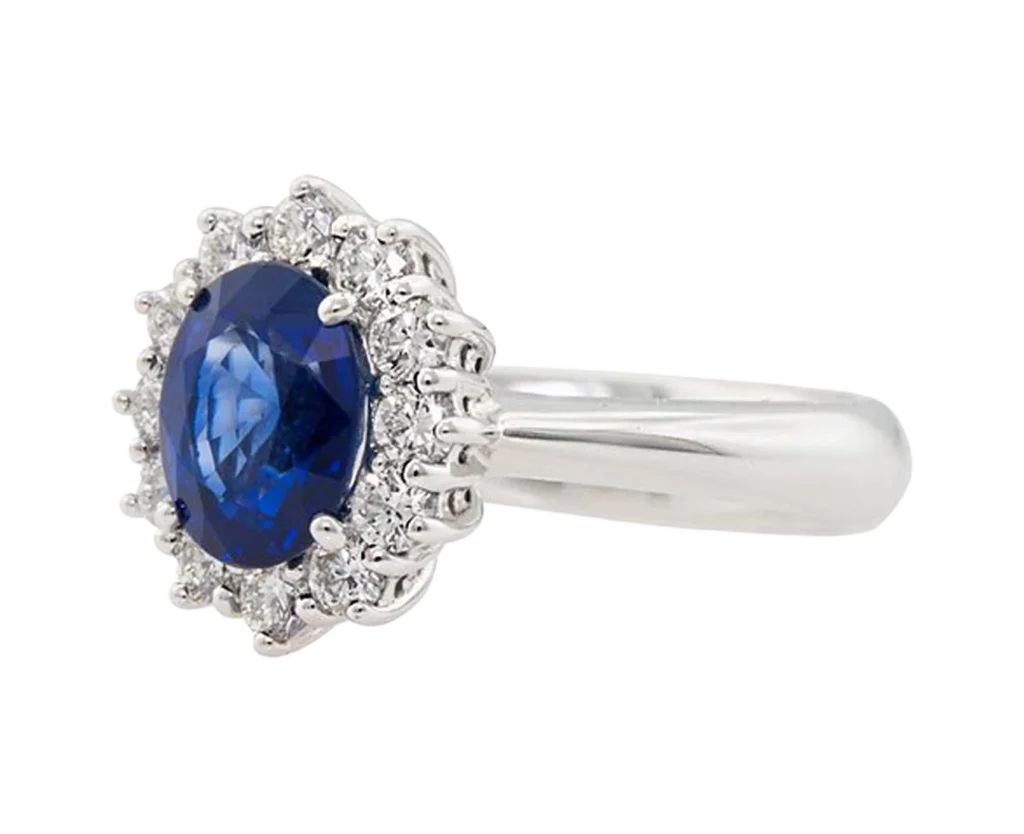 Side view of the Classic Sapphire Ring with a claw-set sapphire and diamond halo