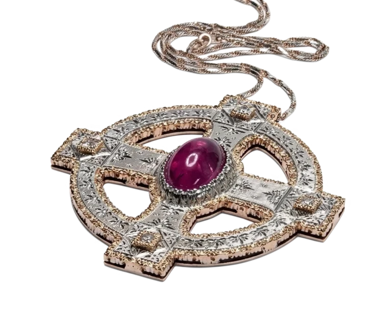 Perspective view of the Celtic cross with cabochon ruby and engraved detailing