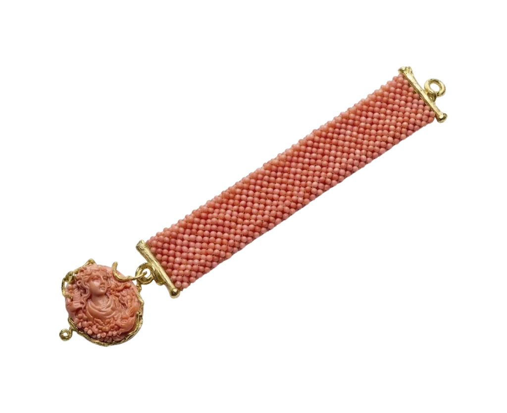 Coral bracelet with cameo and yellow gold setting, flat view