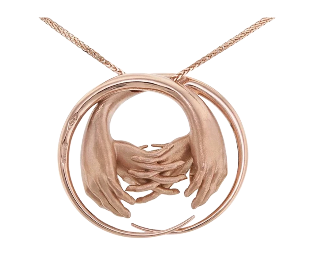Detail of the La Vita rose gold pendant with a circular structure and overlapping hands