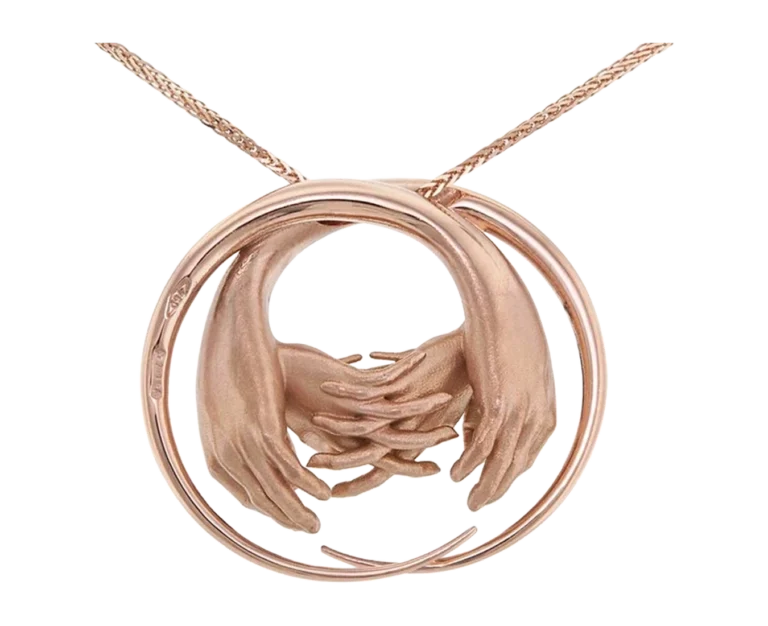 Detail of the La Vita rose gold pendant with a circular structure and overlapping hands