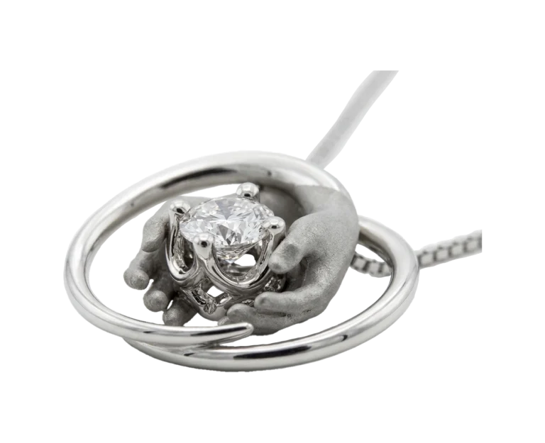 Side view of the A gift for you pendant with natural diamond and modelled hands